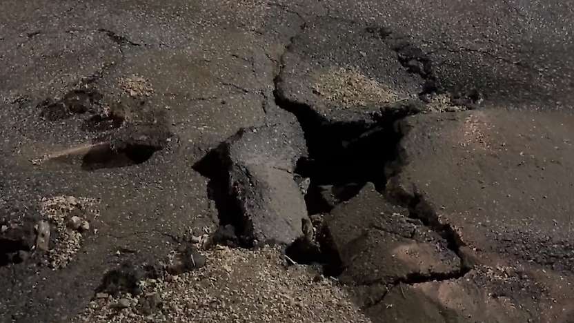Besni'de sağanak yağış yolları çökertti