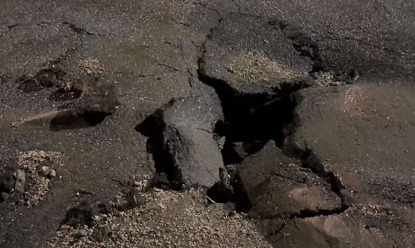 Besni'de sağanak yağış yolları çökertti